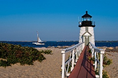 Sailboat Passes by Brant Point Light on Nantucket Island